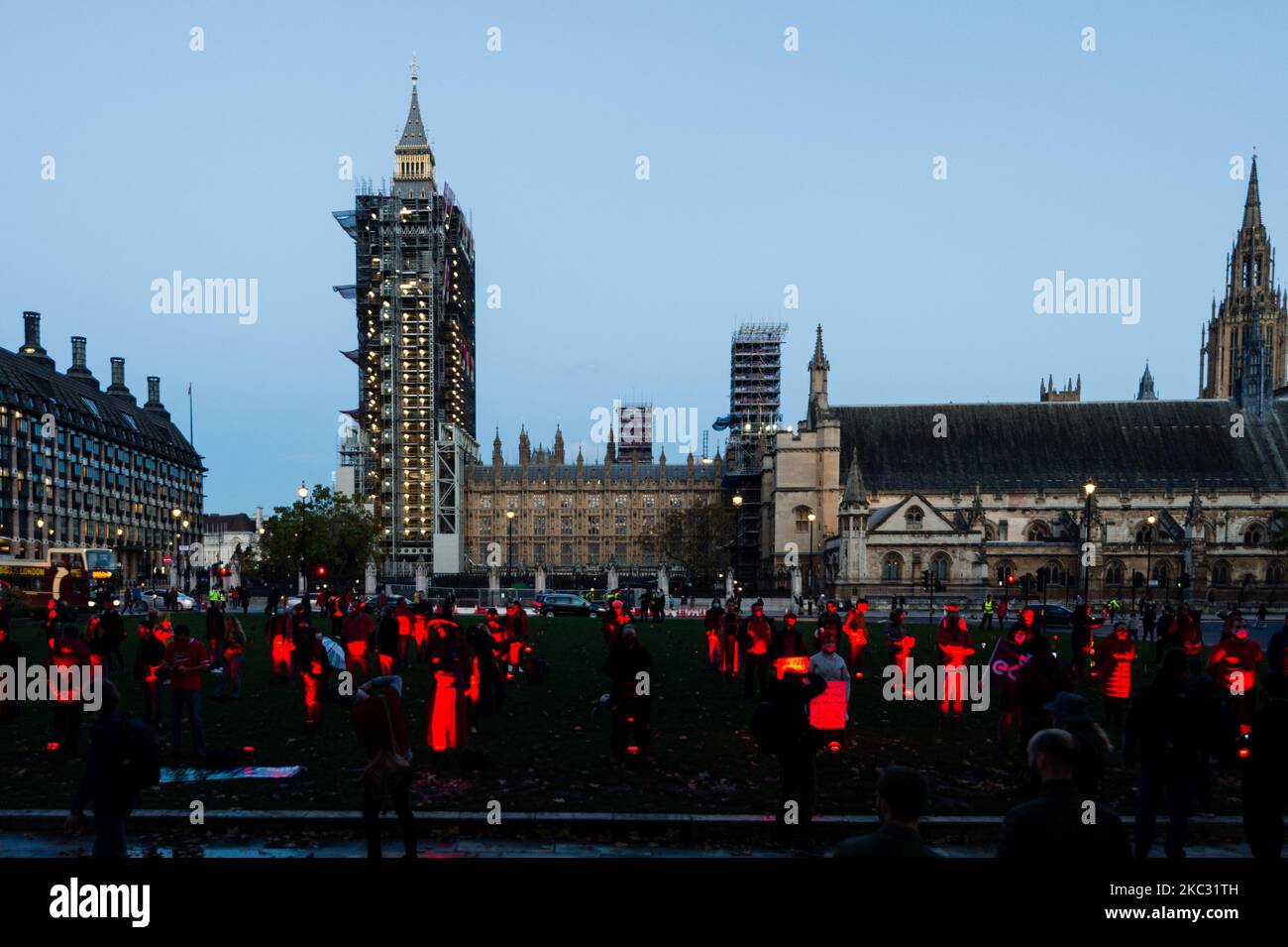 A socially distanced line of #WeMakeEvents supporters and technical crew congregate in the Parliament Square to take their bow following the week’s creative activations on October 31, 2020 in London, United Kingdom. The aim is to showcase the breadth of live events and the technical supply chain that support them, and that live events need government policies in place to help people to return to work and further financial aid until everyone can return. The protest has been organised by We Stand As One #WeMakeEvents who are calling for meaningful support from the Government until the industry i Stock Photo
