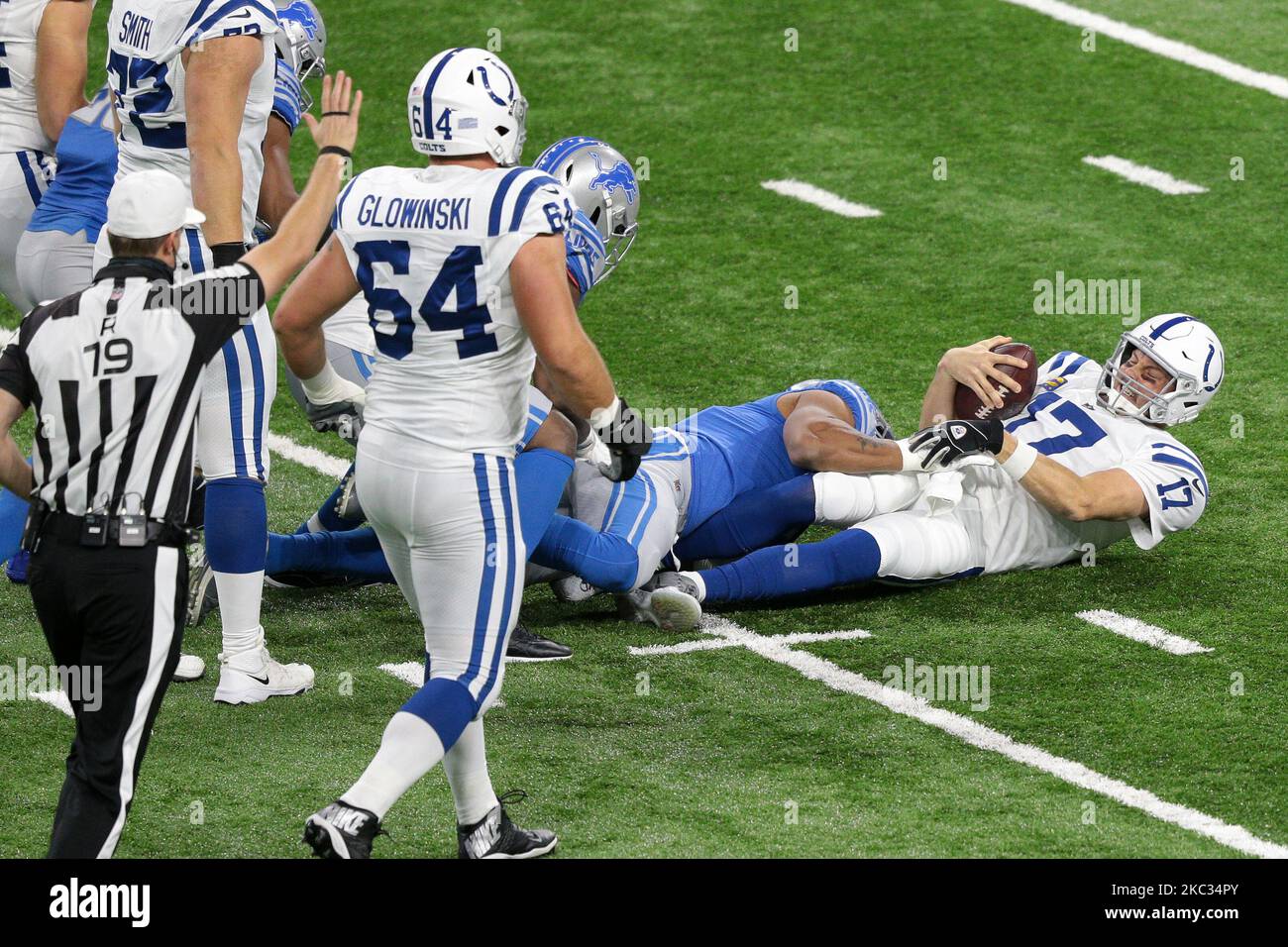 Indianapolis Colts quarterback Philip Rivers (17) is sacked by Detroit