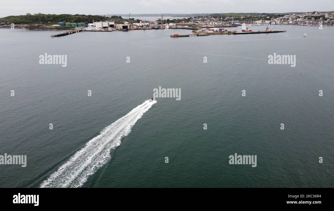 An aerial view of a boat driving to the harbor on the sea Stock Photo ...