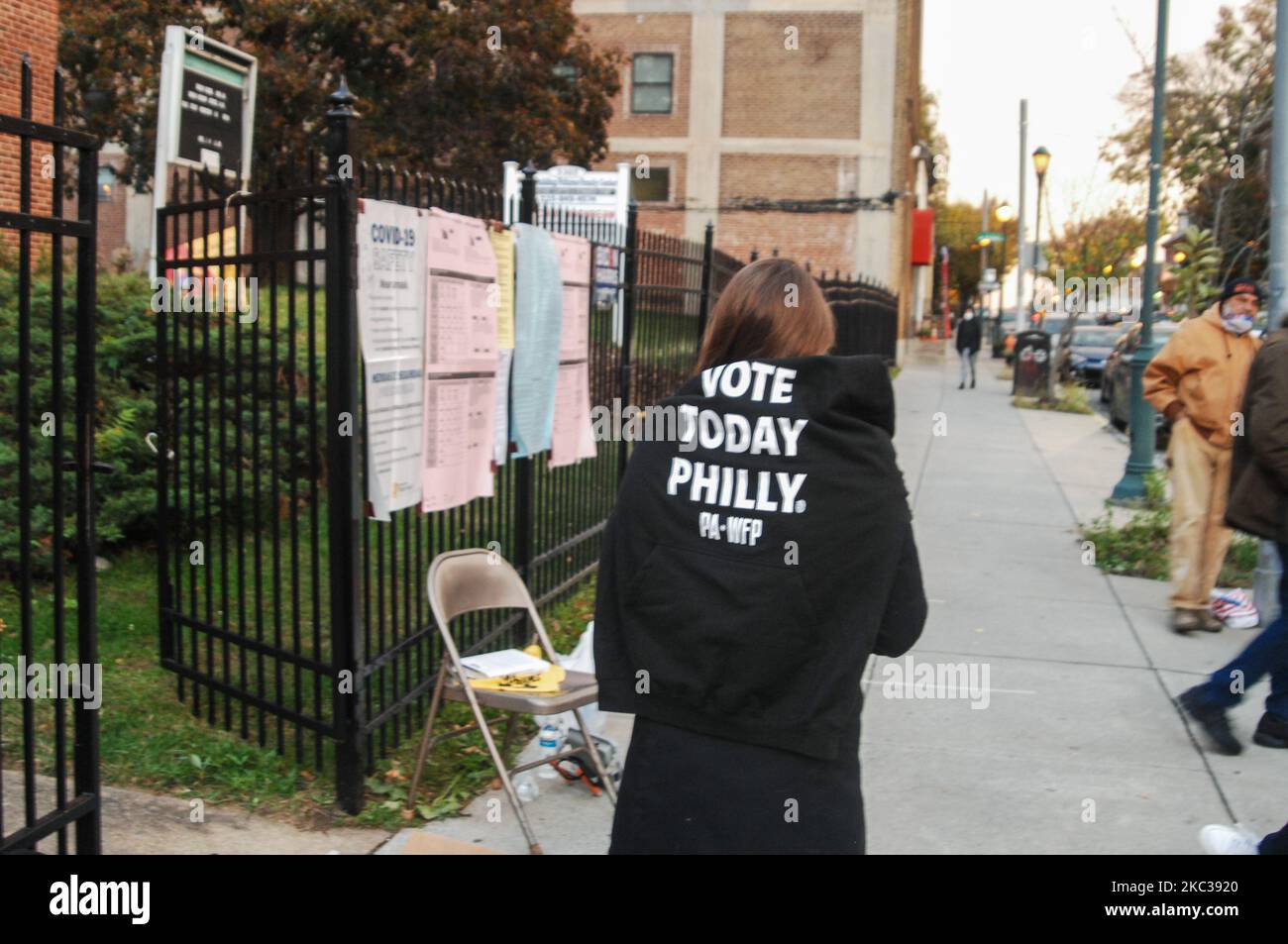 A poll worker wears a sweater over her shoulder advocating for Philadelphians to vote on Election Day in Philadelphia, PA on November 3, 2020. (Photo by Cory Clark/NurPhoto) Stock Photo