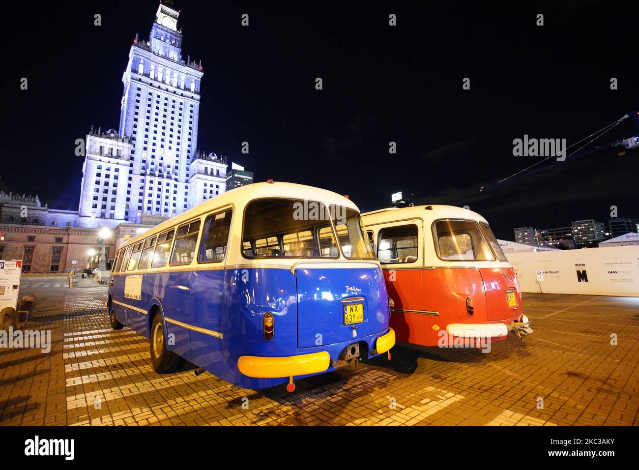 Jelcz 043 buses also called "pickles" are seen parked in front of the Palace of Culture and