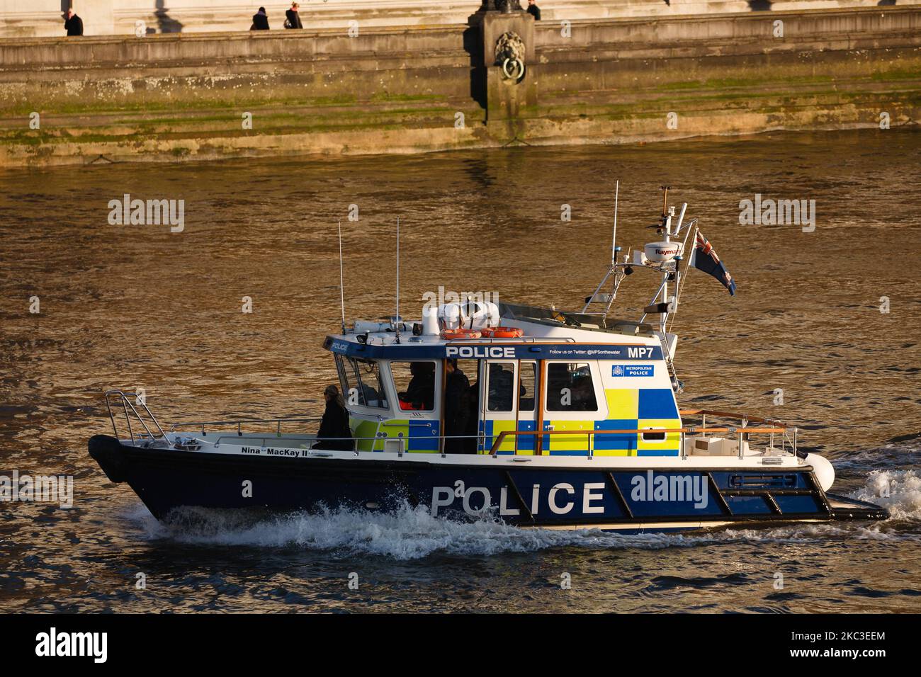 A Metropolitan Police boat motors along the River Thames, seen from Westminster Bridge in London, England, on November 6, 2020. England yesterday began its second national coronavirus lockdown, announced by British Prime Minister Boris Johnson last Saturday, citing fears that covid-19 again threatened to overwhelm the National Health Service (NHS). Pubs, bars, restaurants and non-essential shops are all required to be closed until the currently scheduled end date of December 2. People have meanwhile been asked to stay home as much as possible, although schools and other educational institution Stock Photo