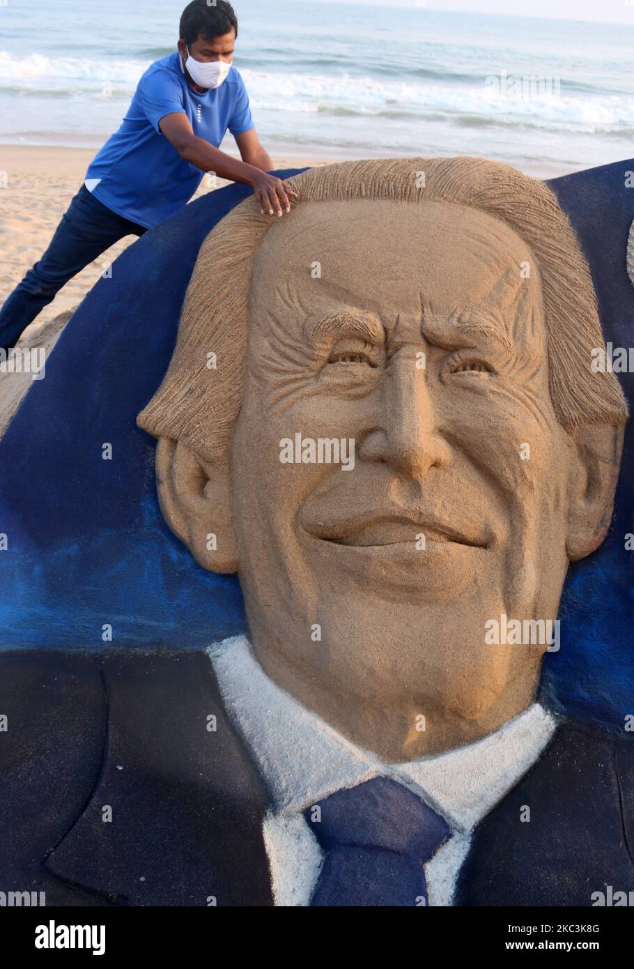 Sand sculpture of Joe Biden and Kamala Harris is seen after their