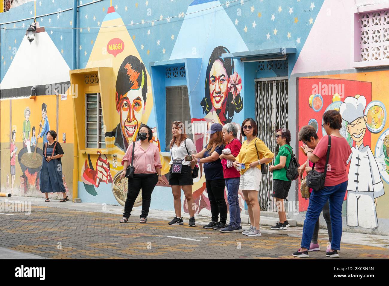 The tourists taking photos at the Seremban Street Art Back Alley Stock Photo