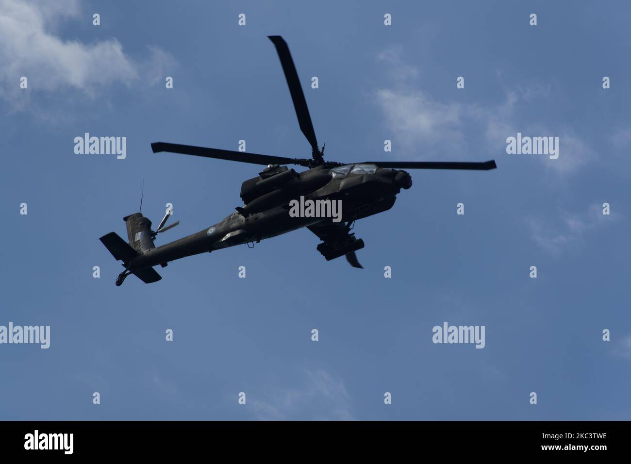 Boeing AH-64 attack helicopter on formation during air show. Greek Air Force Apache flying during October National Oxi Day parade Thessaloniki Greece Stock Photo