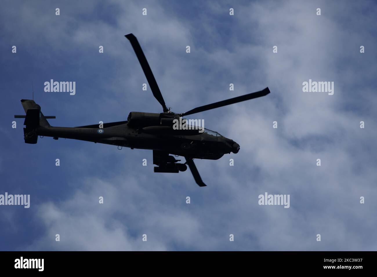 Boeing AH-64 attack helicopter on formation during air show. Greek Air Force Apache flying during October National Oxi Day parade Thessaloniki Greece Stock Photo