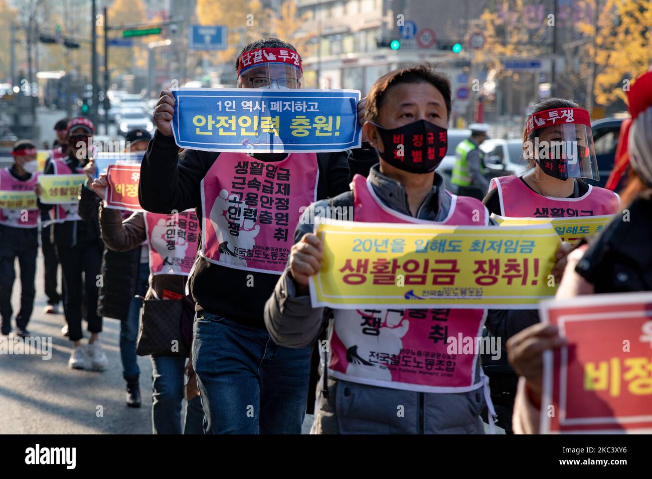 Union members of the railway union march to the Seoul Employment and Labor Office after a press conference declaring a struggle for safety operation at Seoul Station in Yongsan-gu on November 12, 2020 in Seoul , South Korea. They say they work for only a minimum wage for 20 years, and also demand a realistic wage increase and stable employment. (Photo by Chris Jung/NurPhoto) Stock Photo
