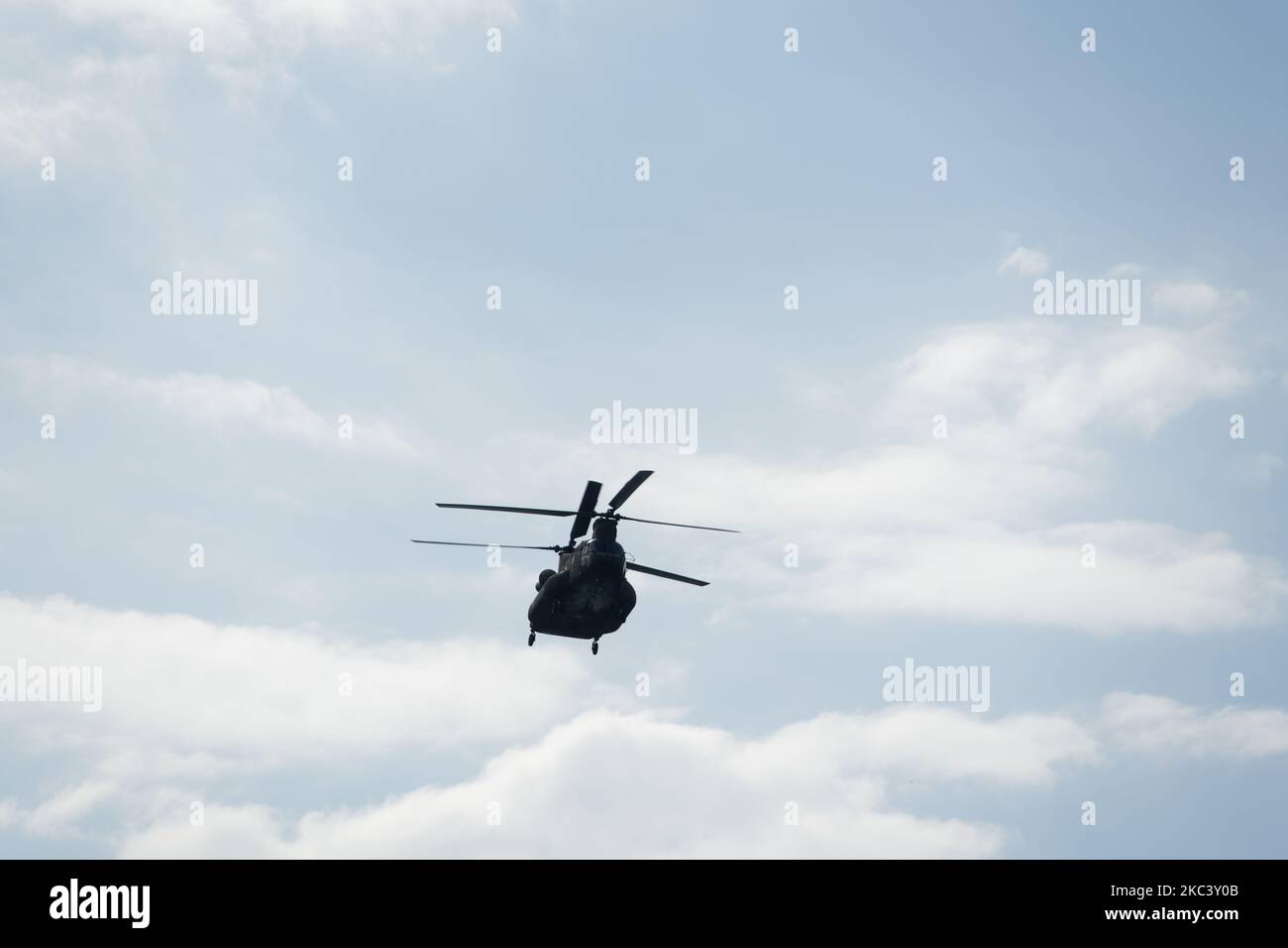 Boeing CH-47 Chinook during an air show. Greek Air Force twin-engine lift helicopter flying during the 28 October Oxi Parade in Thessaloniki, Greece. Stock Photo