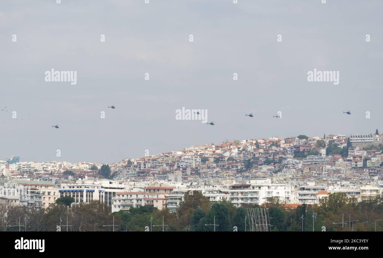 Greek Air Force helicopters flying in formation above a city. Air show during the 28 October National Oxi Day parade in Thessaloniki, Greece. Stock Photo