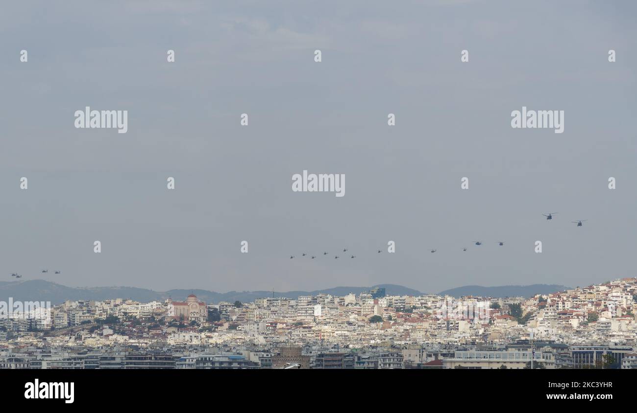Greek Air Force helicopters flying in formation above a city. Air show during the 28 October National Oxi Day parade in Thessaloniki, Greece. Stock Photo
