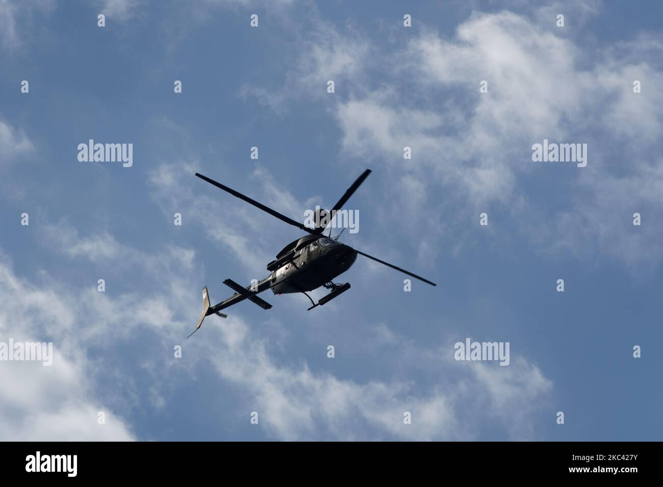 Kiowa Warrior helicopter during an air show. Greek Air Force Bell OH-58 flying during the National Oxi Day parade in Thessaloniki, Greece. Stock Photo