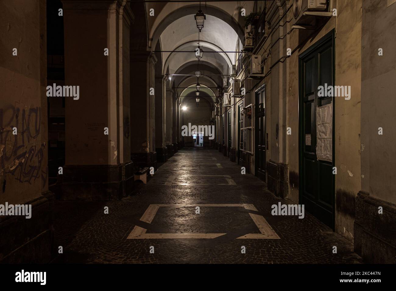 The view of an empty palace porch during the first day of the Red Zone in Aversa, Italy, November 15, 2020. As of today the Campania region is Zona Rossa Covid-19, Campania measures about 4000 contagions per day of Covid-19 and hospitals are collapsing. Today a call for tenders has been made for 450 doctors to fight the Coronavirus in Campania, 150 specialists in Resuscitation, 100 infectivologists, 100 in Respiratory Tract diseases and another 100 specialists in emergency surgery, announced today by the Italian Minister of Regional Affairs, Francesco Boccia. (Photo by Manuel Dorati/NurPhoto) Stock Photo