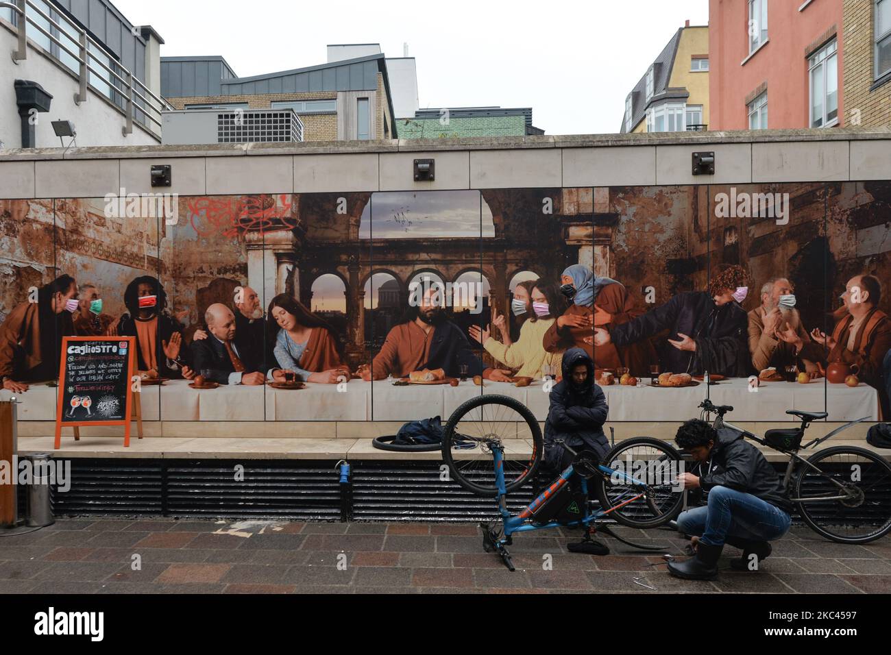 A mural ‘Dublin’s Last Supper’, a large-scale photographic work depicting an modern-day re-enactment of Leonardo da Vinci's ‘The Last Supper’ with an ‘Irish twist’ by Irish artist John Byrne. Recently, due to the ongoing pandemic, colorfull protective face masks were added to the characters. On Monday, November 16, 2020, in Dublin, Ireland. (Photo by Artur Widak/NurPhoto) Stock Photo