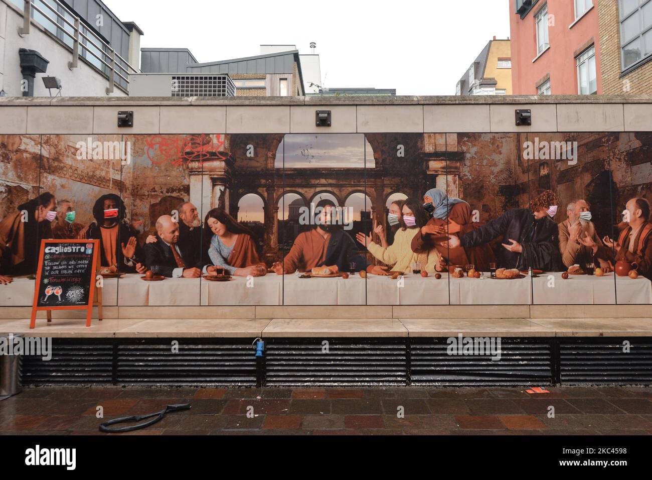 A mural ‘Dublin’s Last Supper’, a large-scale photographic work depicting an modern-day re-enactment of Leonardo da Vinci's ‘The Last Supper’ with an ‘Irish twist’ by Irish artist John Byrne. Recently, due to the ongoing pandemic, colorfull protective face masks were added to the characters. On Monday, November 16, 2020, in Dublin, Ireland. (Photo by Artur Widak/NurPhoto) Stock Photo