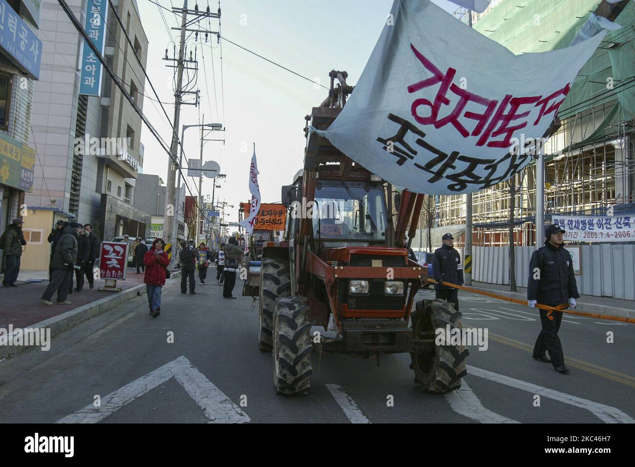 Tractors marching for rally against the new U.S. Military base construction objection at rail station square in Pyeongtaek, South Korea on Dec 11, 2005. Camp Humphreys is a United States Army garrison located near Anjeong-ri and Pyeongtaek metropolitan areas in South Korea. Camp Humphreys is home to Desiderio Army Airfield, the busiest U.S. Army airfield in Asia, with an 8,124 feet runway. In addition to the airfield, there are several U.S. Army direct support, transportation, and tactical units located there, including the Combat Aviation Brigade, 2nd Infantry Division. The garrison has an ar Stock Photo