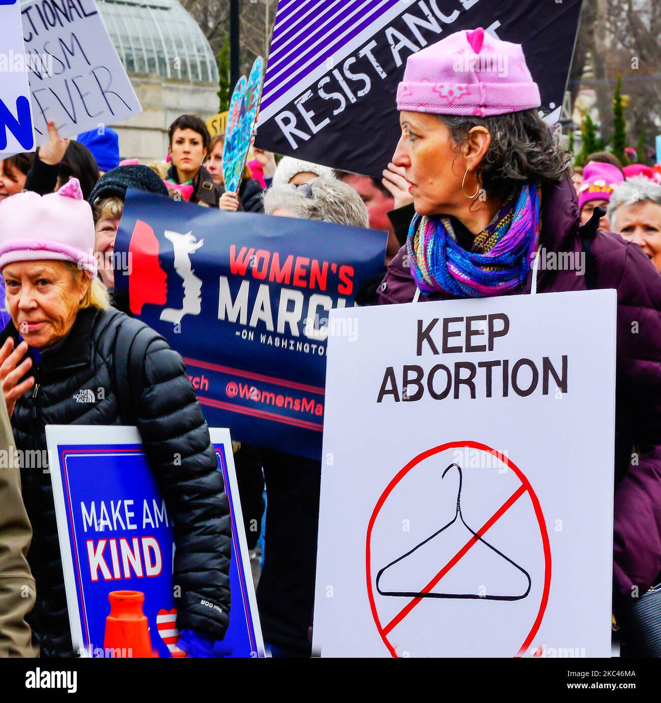 Poster held by woman with coat hanger with red line through it, stating Keep Abortion legal, Roe v wade Abortion rights, Washington DC Stock Photo