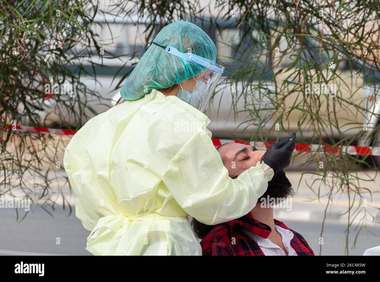 A medical worker, takes a swab sample from a man, for COVID-19 Rapid test, in Yeri, municipality of Nicosia, Cyprus on Nov. 19, 2020. (Photo by George Christophorou/NurPhoto) Stock Photo