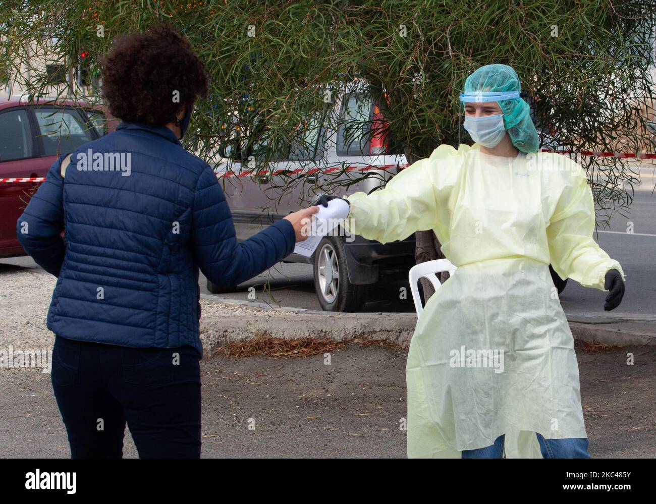 A medical worker, gives to a woman her results, after the Rapid test for COVID-19, in Yeri, municipality of Nicosia, Cyprus on Nov. 19, 2020. (Photo by George Christophorou/NurPhoto) Stock Photo