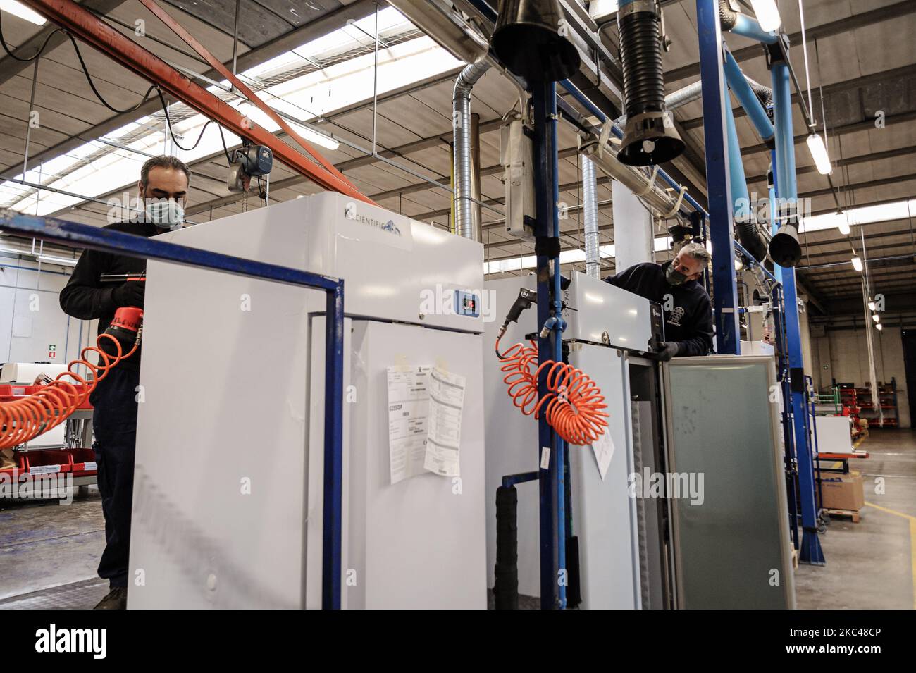 A worker of the Italian company Desmon assembling a part of a