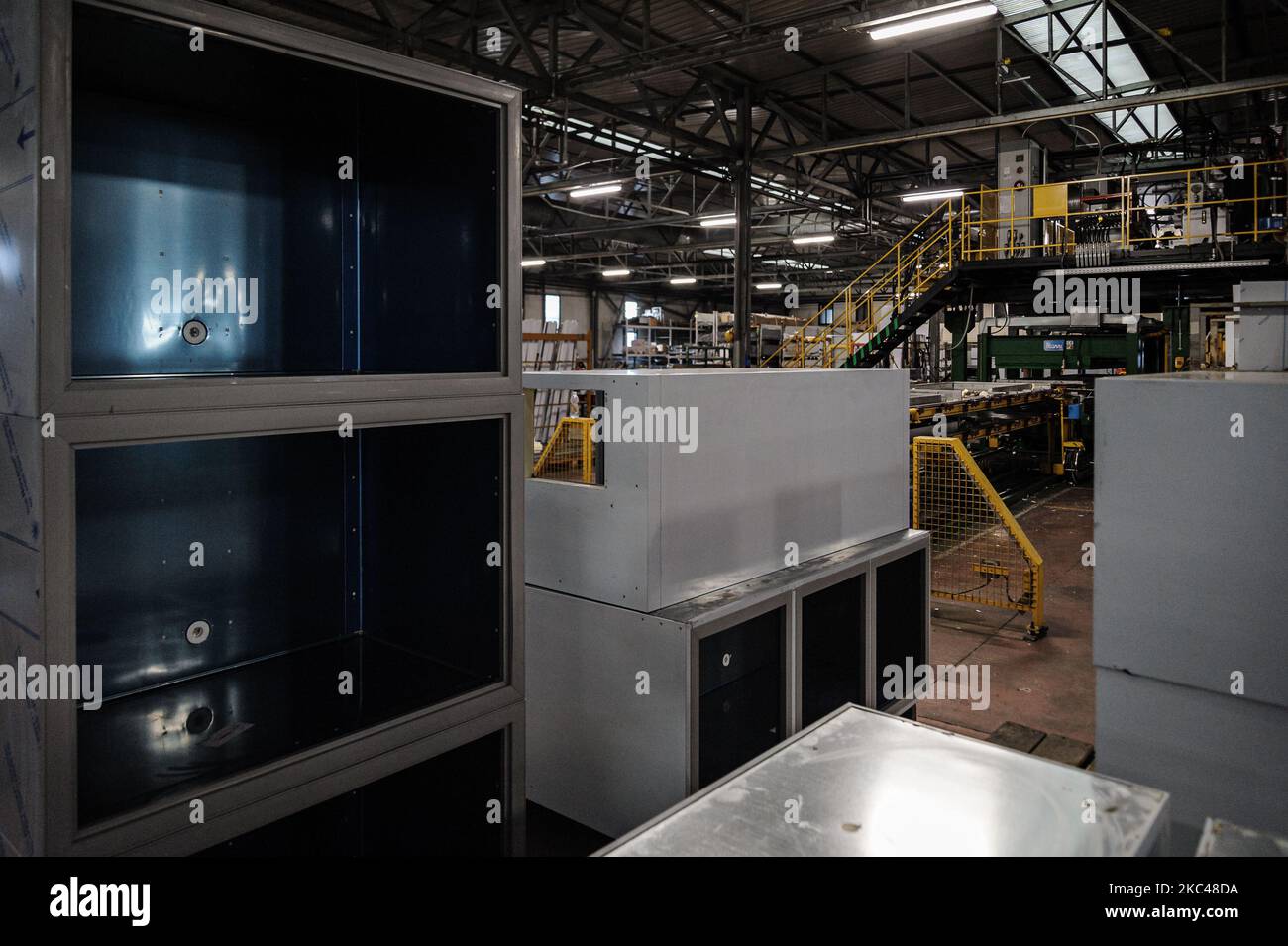 Refrigerator structures under construction can be seen inside the shed