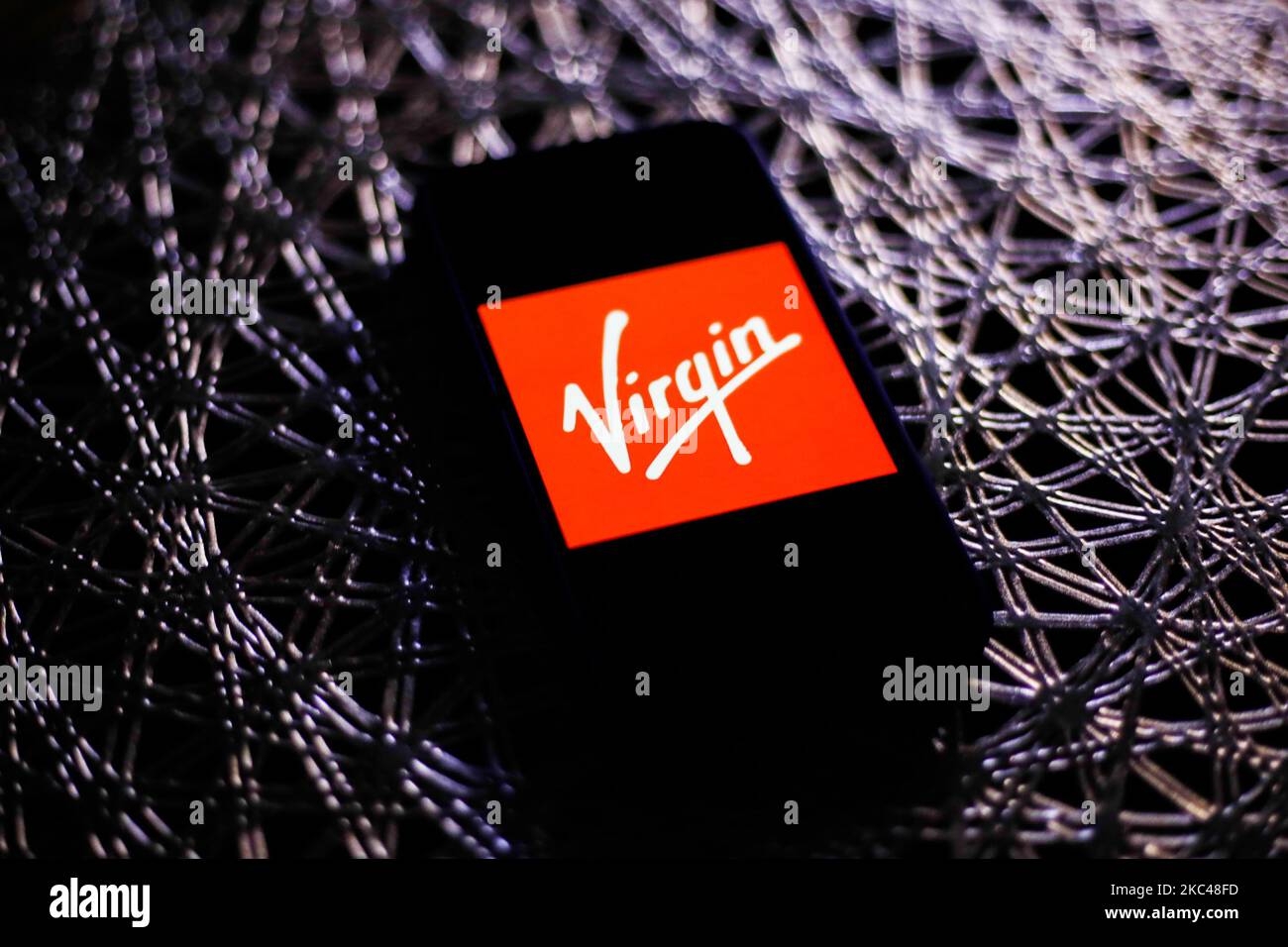 Virgin logo is seen displayed on a phone screen in this illustration photo taken in Poland on November 19, 2020. (Photo by Jakub Porzycki/NurPhoto) Stock Photo