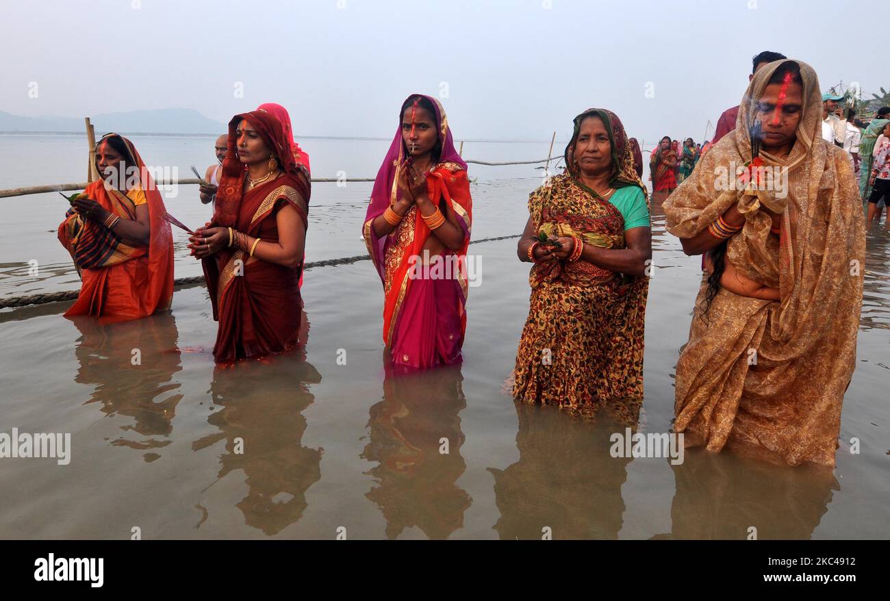 Hindu devotees offer prayers during the Chhath Puja Festival on the ...