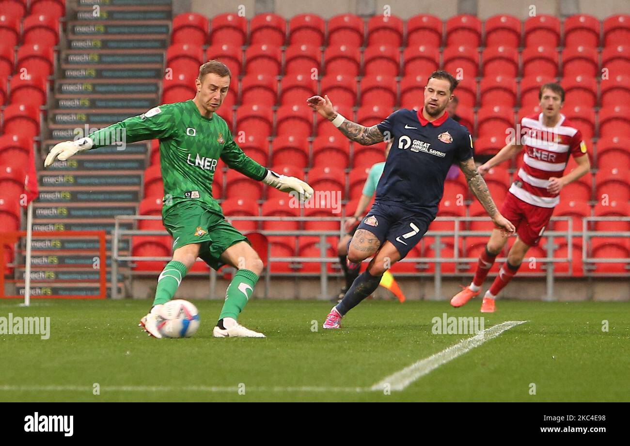 Chris Maguire(7) closes down Doncaster Goal Keeper Joe Lumley during the first half during the Sky Bet League 1 match between Doncaster Rovers and Sunderland at the Keepmoat Stadium, Doncaster on Saturday 21st November 2020. (Photo by Michael Driver/MI News/NurPhoto) Stock Photo