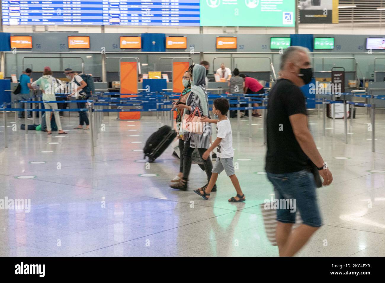 Passengers seen with the obligatory face masks at the main departure