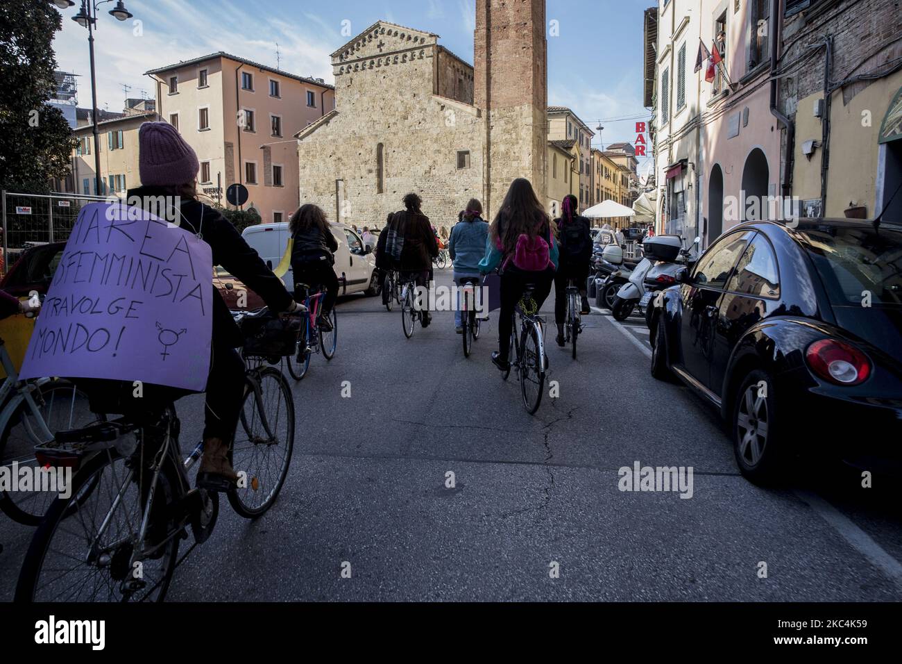 Feminist activists gathered today, 25 November 2020, for the International Day for the Elimination of Violence against Women, in Pisa, Italy. Despite the anti-covid measures, the activists decided to make a symbolic gesture by riding the bikes across the city with slogans and chants. (Photo by Enrico Mattia Del Punta/NurPhoto) Stock Photo