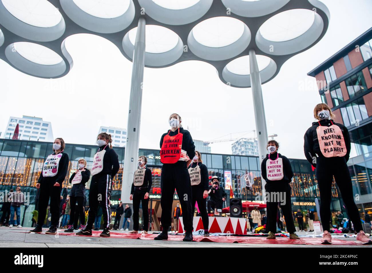 Activists acrobats are posing with climate messages in front of the biggest shopping mall in The Netherlands during the 'Circus protest' against Black Friday, in Utrecht, on November 27th, 2020. (Photo by Romy Arroyo Fernandez/NurPhoto) Stock Photo