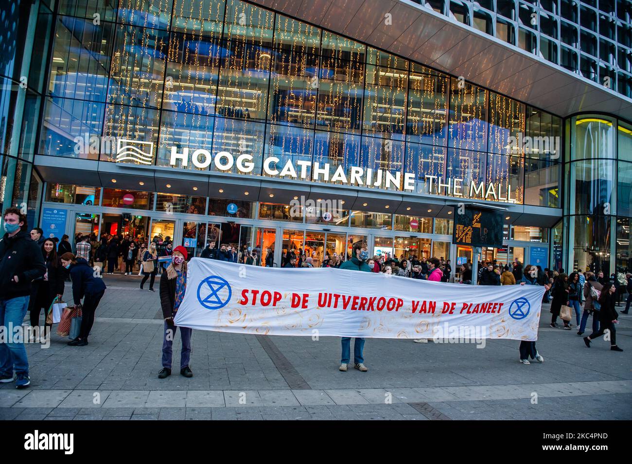 Climate activists are holding a big banner against consumerist, in front of the biggest shopping mall in The Netherlands during the 'Circus protest' against Black Friday, in Utrecht, on November 27th, 2020. (Photo by Romy Arroyo Fernandez/NurPhoto) Stock Photo