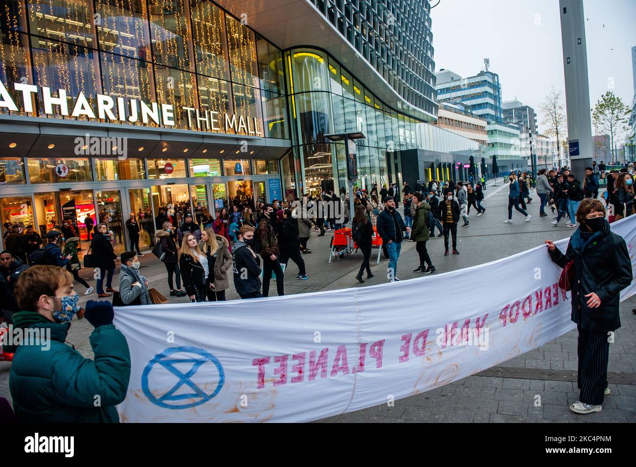 Climate activists are holding a big banner against consumerist, in front of the biggest shopping mall in The Netherlands during the 'Circus protest' against Black Friday, in Utrecht, on November 27th, 2020. (Photo by Romy Arroyo Fernandez/NurPhoto) Stock Photo