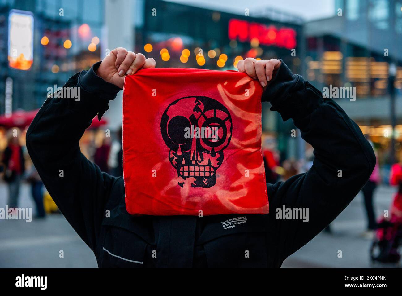 An activist is showing a bib with a skull printed on it, during the 'Circus protest' against Black Friday, in Utrecht, on November 27th, 2020. (Photo by Romy Arroyo Fernandez/NurPhoto) Stock Photo