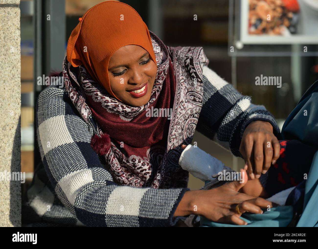 Ifrah Ahmed, a Somali-Irish social activist seen with her daughter in Dublin city center. Born into a refugee camp in war-torn Somalia, Ifrah was trafficked to Ireland as a teenager. Recounting her traumatic childhood experiences of Female Genital Mutilation / Cutting (FGM/C) when applying for refugee status, she was again traumatized and decided to devote her life to the eradication of the practice. Ifrah emerged as one of the worlds foremost international activists against Gender Based Violence, after she took her campaign all the way to the President of Ireland and finally to the European P Stock Photo