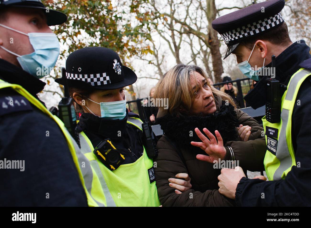 An anti-lockdown activist is arrested at Marble Arch during a demonstration in London, England, on November 28, 2020. In an evening update the Metropolitan Police announced it had made 155 arrests over the course of the day's demonstrations, for offences including breaches of coronavirus regulations, assault on police and possession of drugs. London is to return to 'Tier 2' or 'high alert' covid-19 restrictions once the current England-wide coronavirus lockdown ends next Wednesday. All three of the tiers, assigned to local authorities across England, have been strengthened since the lockdown b Stock Photo