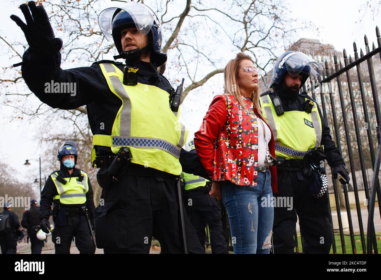 An anti-lockdown activist is arrested on Birdcage Walk during a demonstration in London, England, on November 28, 2020. In an evening update the Metropolitan Police announced it had made 155 arrests over the course of the day's demonstrations, for offences including breaches of coronavirus regulations, assault on police and possession of drugs. London is to return to 'Tier 2' or 'high alert' covid-19 restrictions once the current England-wide coronavirus lockdown ends next Wednesday. All three of the tiers, assigned to local authorities across England, have been strengthened since the lockdown Stock Photo