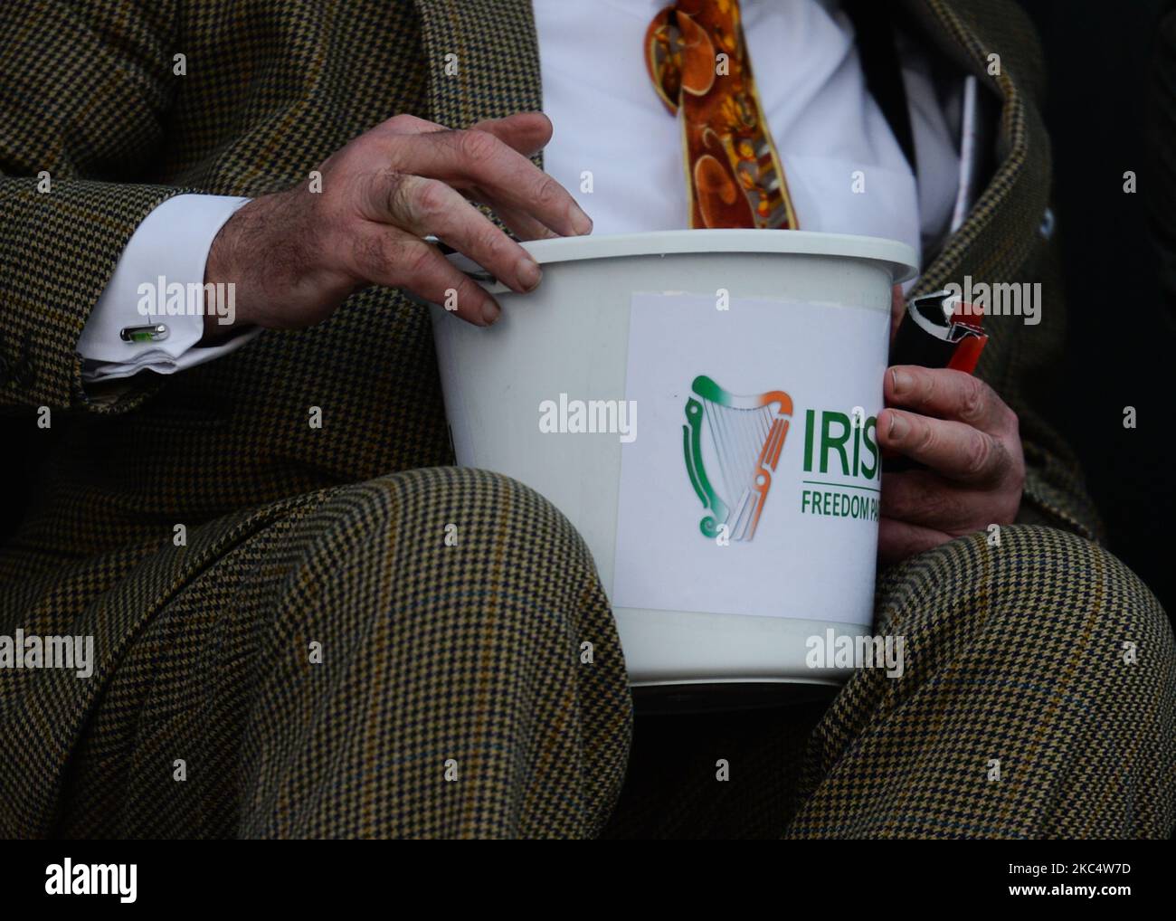 A member of the Irish Freedom Party collecting monay during an anti-vaccination and anti-lockdown rally, on day 39 of the nationwide Level 5 lockdown. On Saturday, November 28, 2020, in Dublin, Ireland. (Photo by Artur Widak/NurPhoto) Stock Photo