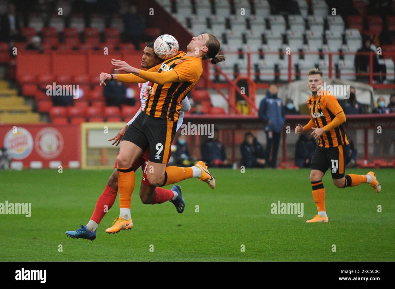 Hull Citys Tom Eaves controls the ball while under pressure from Stevenages Terence Vancooten during the FA Cup match between Stevenage and Hull City at the Lamex Stadium, Stevenage on Sunday 29th November 2020. (Photo by Ben Pooley/MI News/NurPhoto) Stock Photo
