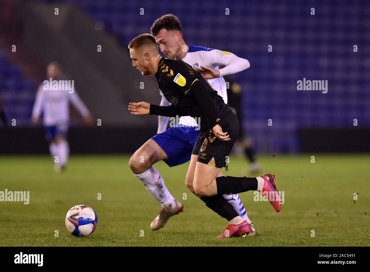 Oldham Athletic's Davis Keillor-Dunn tussles with Tranmere Rovers' Paul Lewis during the Sky Bet League 2 match between Oldham Athletic and Tranmere Rovers at Boundary Park, Oldham on Tuesday 1st December 2020. (Photo by Eddie Garvey/MI News/NurPhoto) Stock Photo