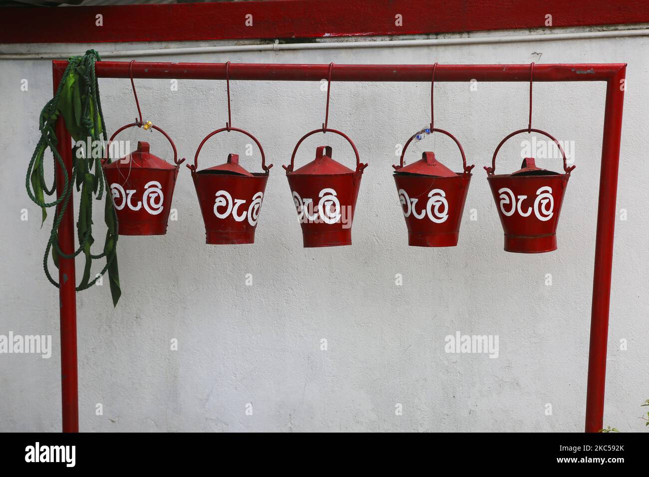 Fire buckets at a filling station in the city of Kandy, Sri Lanka