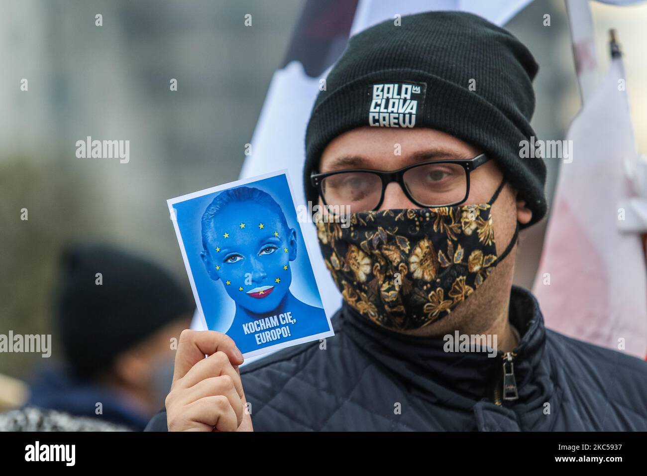 Protester wearing face mask due the coronavirus restrictions , holding European Union flag sahped sticker with inscription We Love You Europe is seen in Gdansk, Poland on 5 December 2020 People protest against Polish government EU budget veto. They say that the veto is a so called Polexit (leaving EU by t Poland) first step. (Photo by Michal Fludra/NurPhoto) Stock Photo