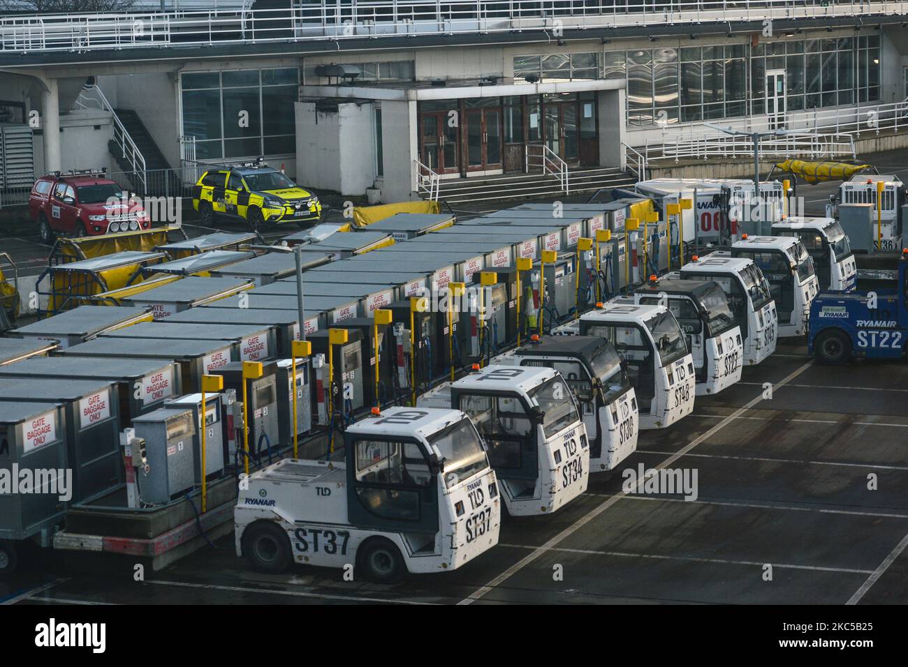 Airport tractors and baggage boxes seen at Dublin Airport, during the coronavirus lockdown level