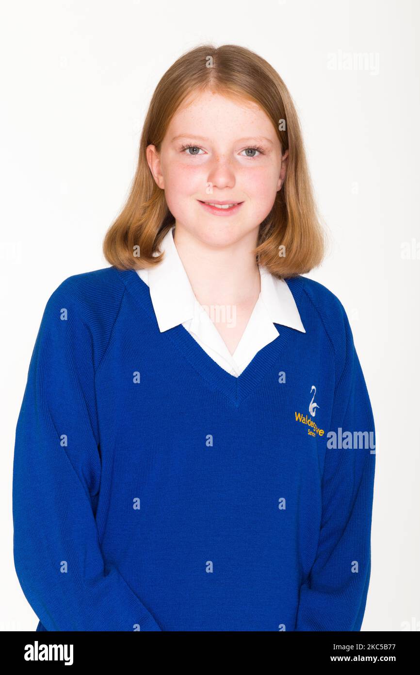 Secondary school photo / photograph picture / face / traditional and classic style child head and shoulders type portrait of a Year 8 class girl in uniform. UK. (132) Stock Photo
