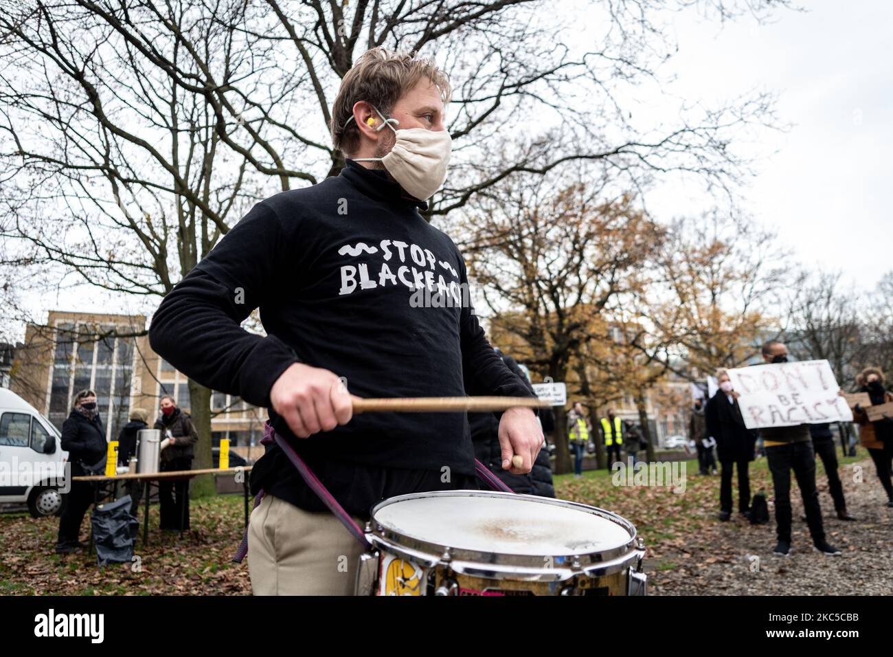Protester with drums at Koekamp The Hague, Netherlands, on December 6, 2020. Just after the official Sinterklaas (Dutch Santa) celebrations a broad leftwing coalition of mostly climate activists organise a solidarity protest against racism, especially targeted against the use of blackface as Santa's helper. More than thousand people gatherd at the Koekamp, a location near the trainstation. Although these protest most of the are met with rightwing counterprotesters the demonstration was without incidents. (Photo by Oscar Brak/NurPhoto) Stock Photo
