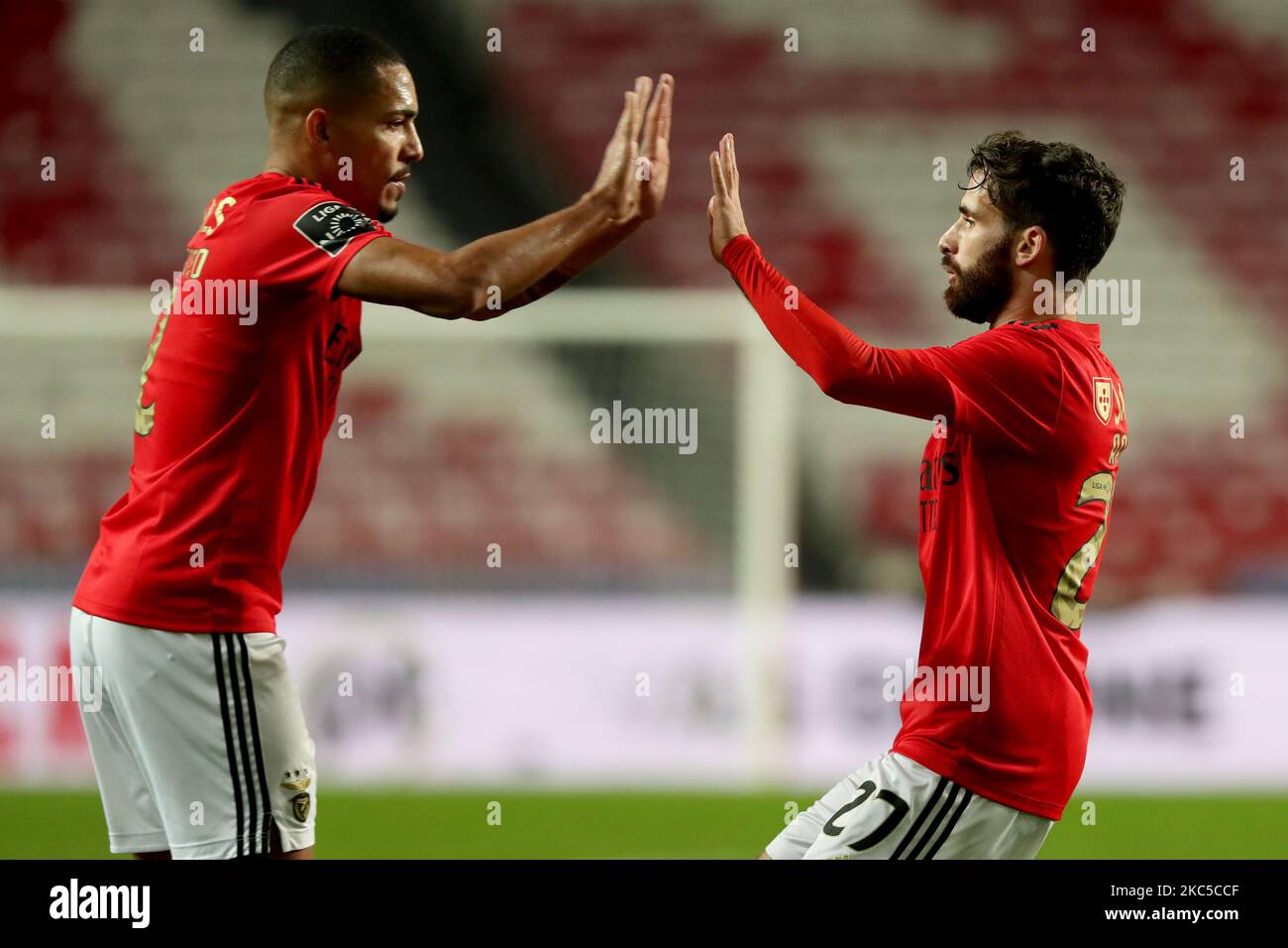Rafa Silva of SL Benfica (R ) celebrates with Gilberto after scoring during the Portuguese League football match between SL Benfica and FC Pacos Ferreira at the Luz stadium in Lisbon, Portugal on December 6, 2020. (Photo by Pedro FiÃºza/NurPhoto) Stock Photo