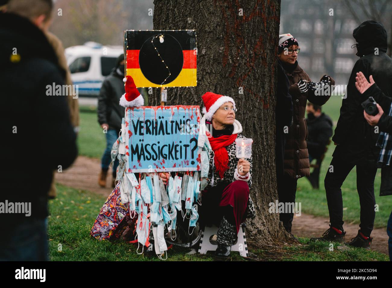 a protester with self made sign'proportionality' during the Querdenken protest in Duesseldorf, Germany, on December 6, 2020 share star border (Photo by Ying Tang/NurPhoto) Stock Photo