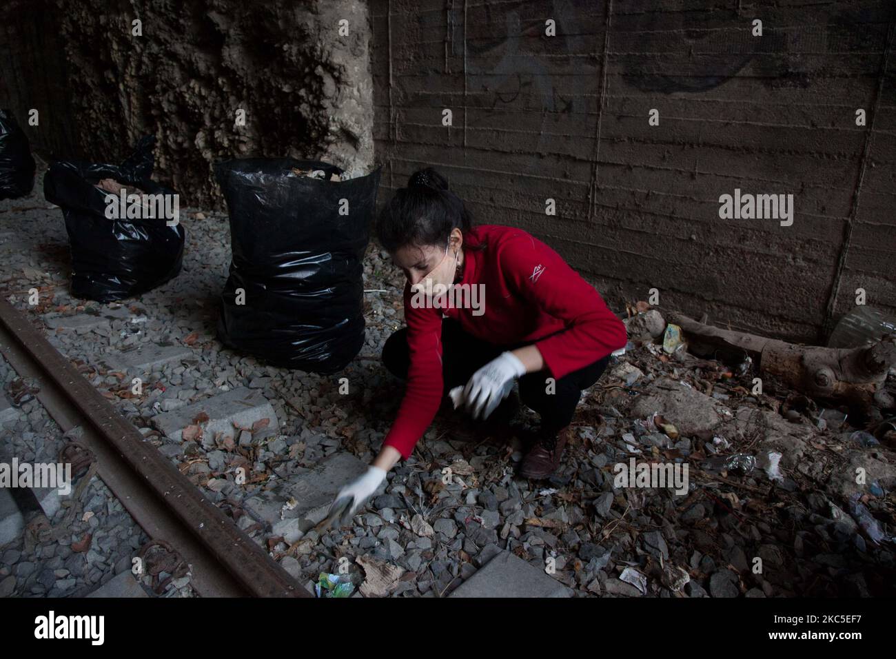 A volunteer of 'save your hood' team picks up some rubbish, in Athens, Greece, Saturday, Dec. 5, 2020. Due to the coronavirus situation the number of garbage increases in outdoors. (Photo by Konstantinos Zilos/NurPhoto) Stock Photo
