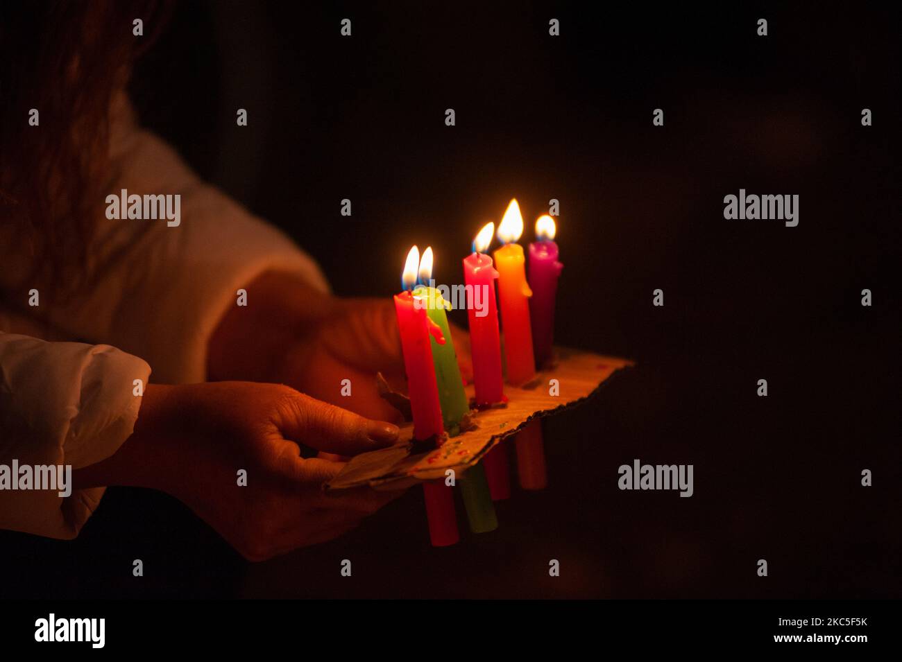 People gather at the Park Way avenue in Bogota to light candles on the
