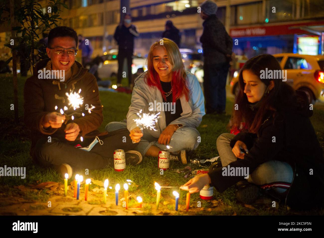 People gather at the Park Way avenue in Bogota to light candles on the