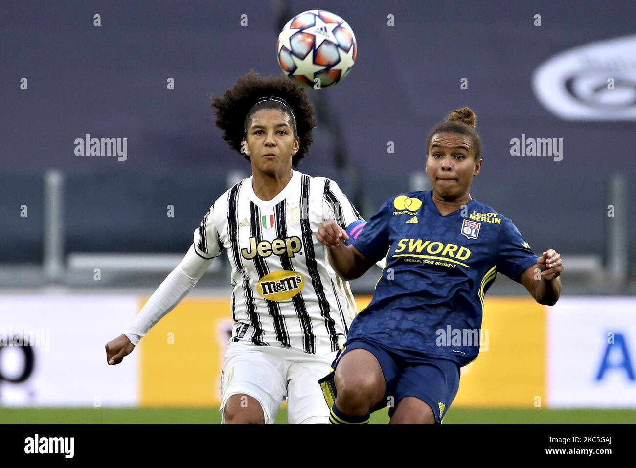 Sara Gama of Juventus competes for the ball with Nikita Parris of Olympique Lyonnais during the UEFA Women's Champions League round of 32 first leg match between Juventus Women and Olympique Lyonnais Women at Juventus Stadium on December 09, 2020 in Turin, Italy. (Photo by Giuseppe Cottini/NurPhoto) Stock Photo